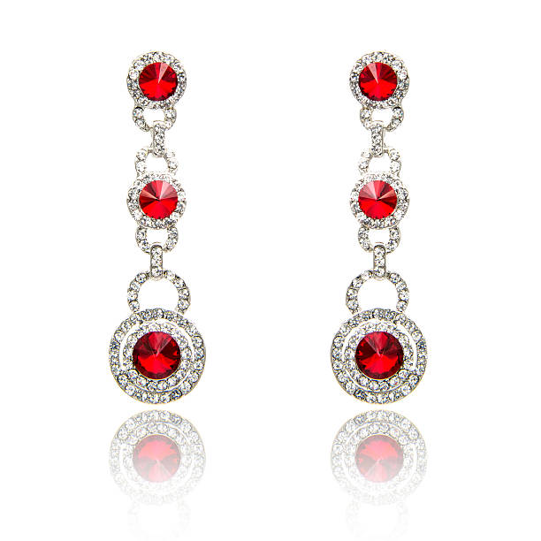 istock Pair of ruby diamond earrings isolated on white 615798146