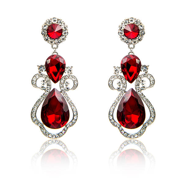 istock Pair of ruby diamond earrings isolated on white 615798286