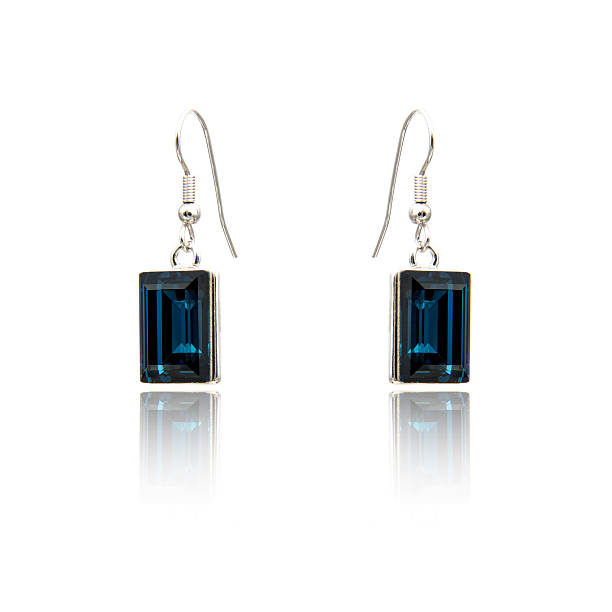 istock Pair of sapphire earrings isolated on white 615798518