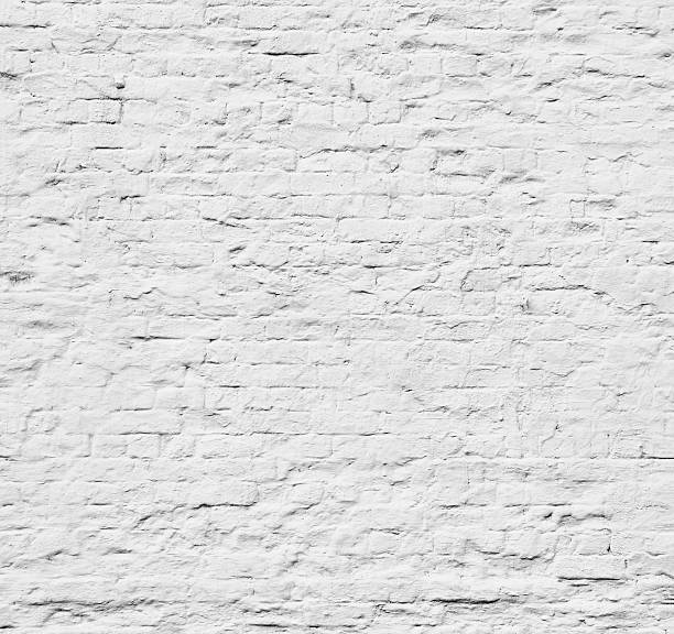 istock Brick grunge white painted crack wall texture background 615798566
