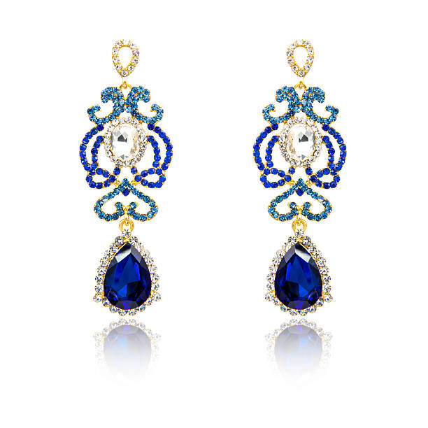 istock Pair of sapphire earrings isolated on white 615799038
