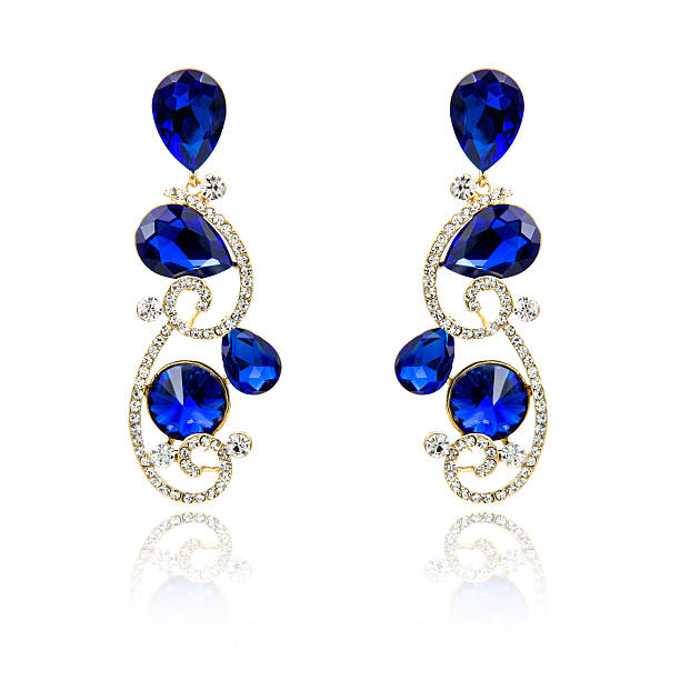 istock Pair of sapphire earrings isolated on white 615799150
