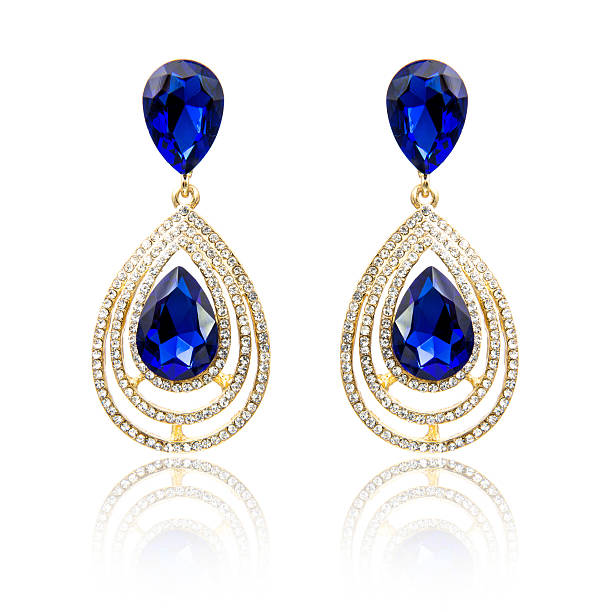 istock Pair of sapphire earrings isolated on white 615799208