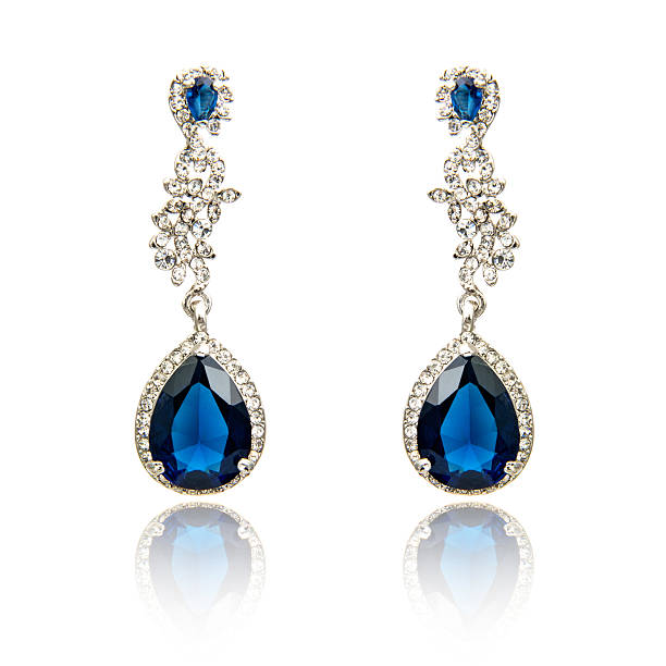 istock Pair of sapphire earrings isolated on white 615799354