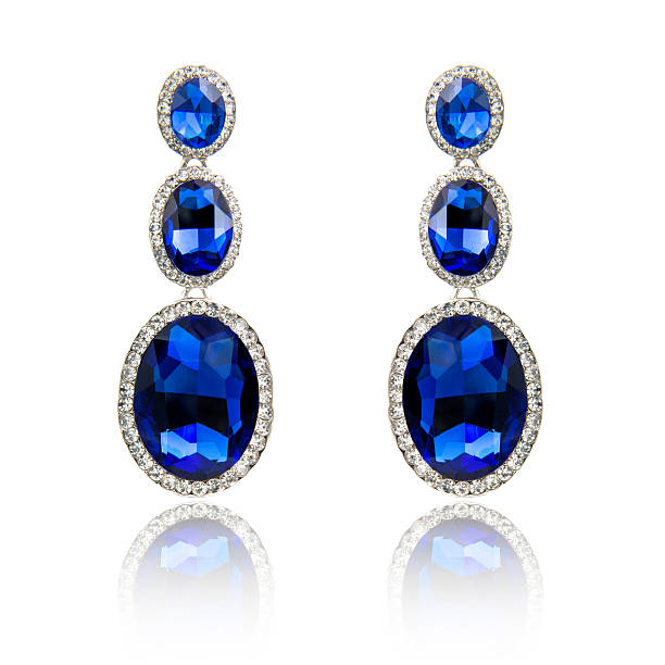istock Pair of sapphire earrings isolated on white 615799406