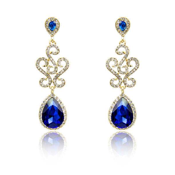 istock Pair of sapphire earrings isolated on white 615799462