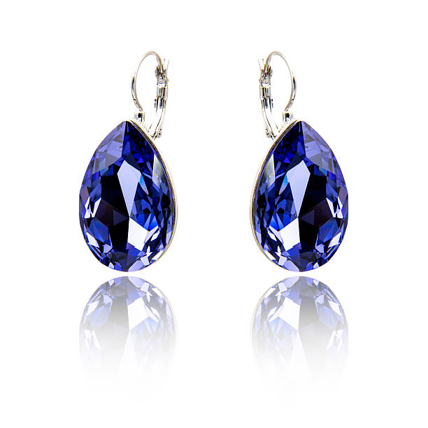 istock Pair of sapphire earrings isolated on white 615799548