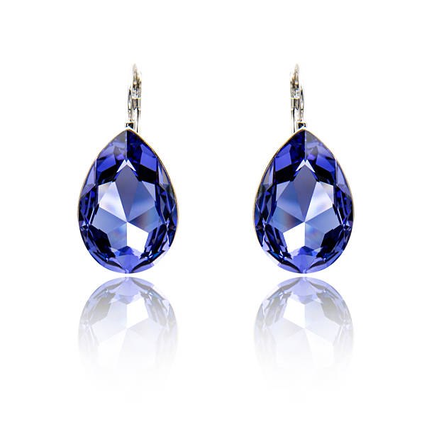 istock Pair of sapphire earrings isolated on white 615799576