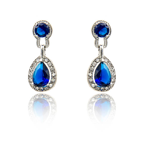 istock Pair of sapphire earrings isolated on white 615799968
