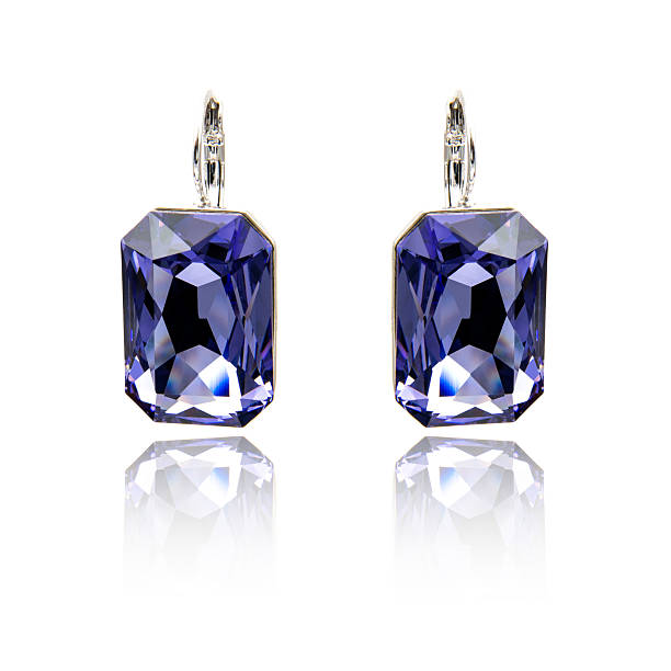 istock Pair of sapphire earrings isolated on white 615800070