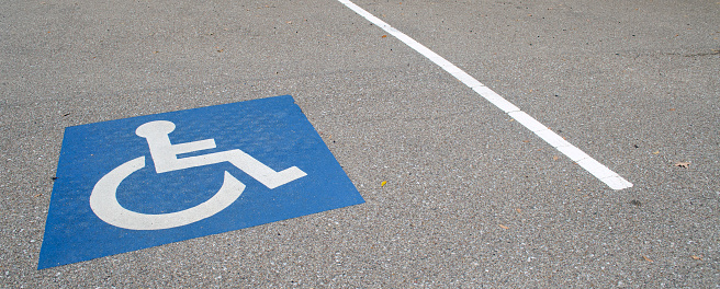 Handincapped designated parking space in a parking lot.