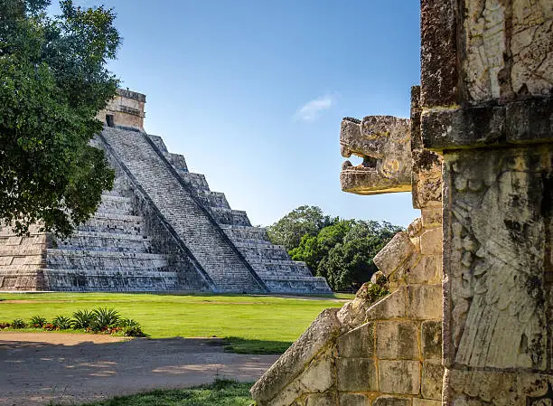 Jaguar head and Mayan Temple pyramid  of Kukulkan - Chichen Itza, Yucatan, Mexico