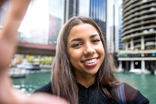 Woman teen in Chicago downtown having fun waiting for friends