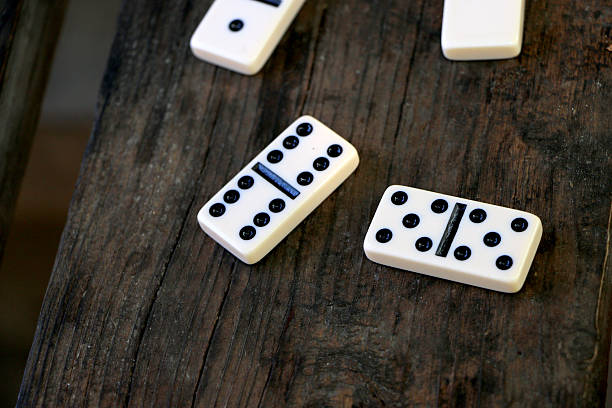istock Dominoes scattered on the table, after playing outdoors 615806668