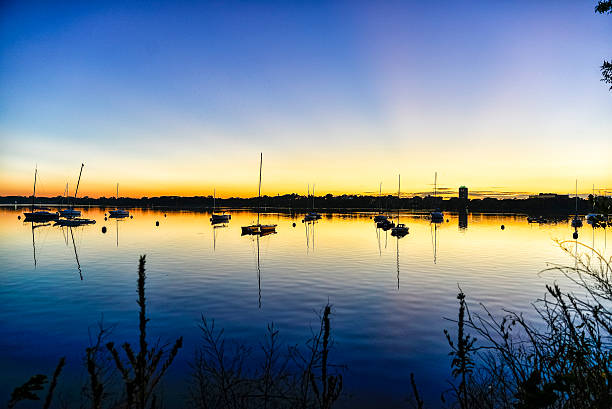 istock Sailboats on Lake at Dusk 615806950