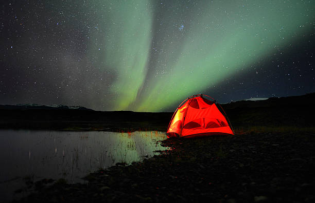 istock Camp, tent and Northern Lights in Iceland 615807902