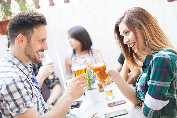 istock Group Of Friends Enjoying Drink 615809092