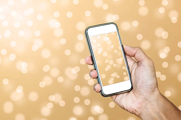 istock Hand using Smartphone taking a Photo of Defocus Bokeh Lights 615811578