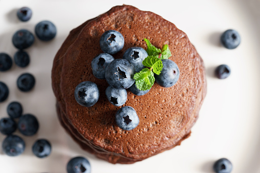 stack of sweet chocolate pancakes with fresh blueberry