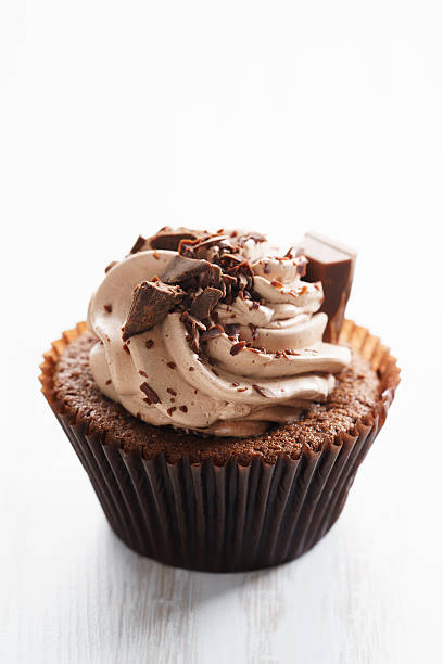 istock chocolate cupcake with chocolate butter cream swirl 615812426