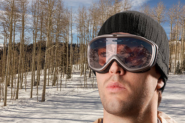 istock skier looking for a snowy mountain. 615812442