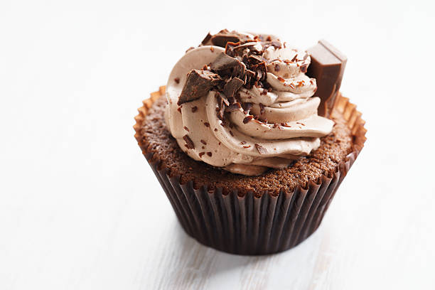 istock chocolate cupcake with chocolate butter cream swirl 615812454