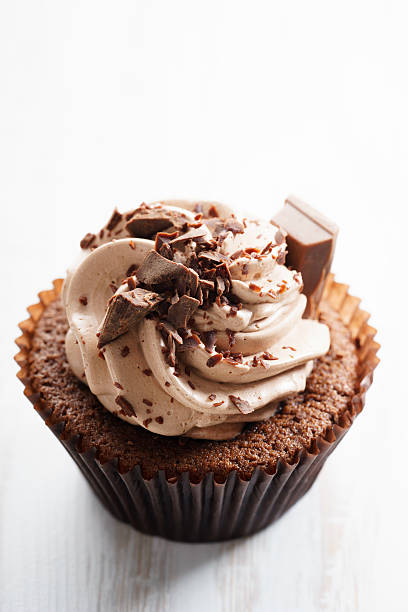 istock chocolate cupcake with chocolate butter cream swirl 615812536