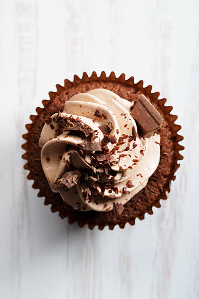 istock chocolate cupcake with chocolate butter cream swirl 615812574