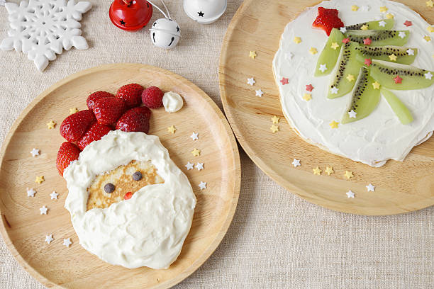 istock Fun homemade santa and christmas tree pancakes breakfast for kid 615812992