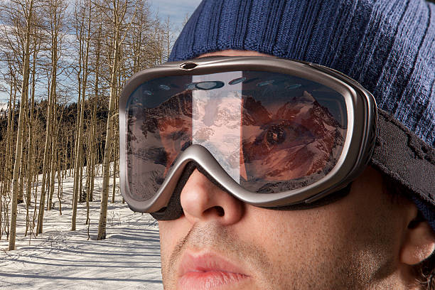 istock skier looking for a snowy mountain. 615813698