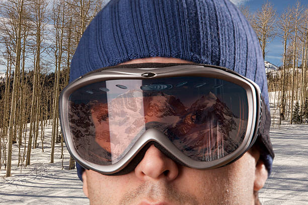 istock skier looking for a snowy mountain. 615814360