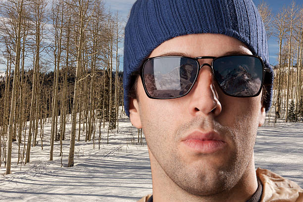 istock skier looking for a snowy mountain. 615815890