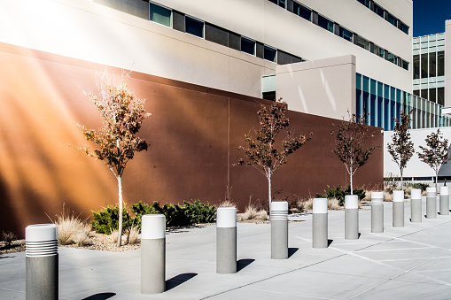 Bollards on the sidewalk of the University Hospital Building in Rio Rancho, New Mexico.