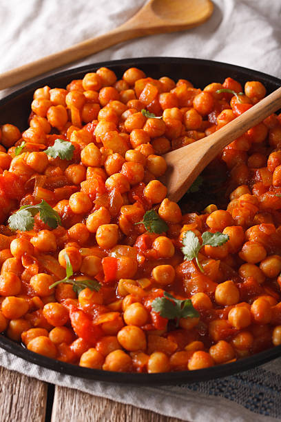 istock Indian Food: chickpeas in curry sauce close-up. vertical 615816282