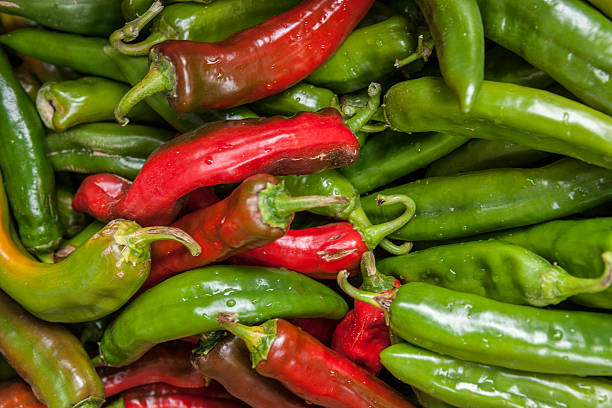 istock Red and green jalapeno peppers. 615817050