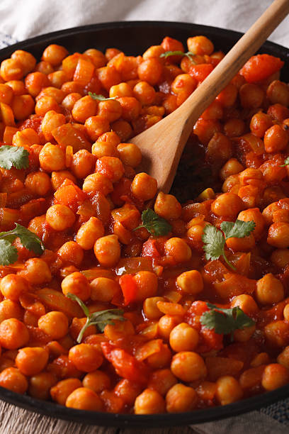istock Traditional Indian cuisine: Chana masala macro. vertical 615818900