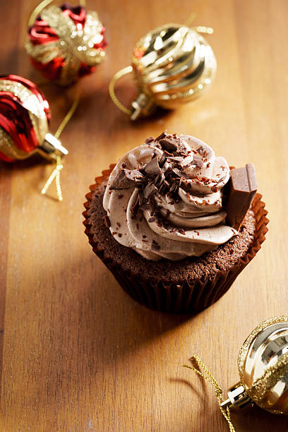 istock chocolate cupcake with chocolate butter cream swirl 615819802