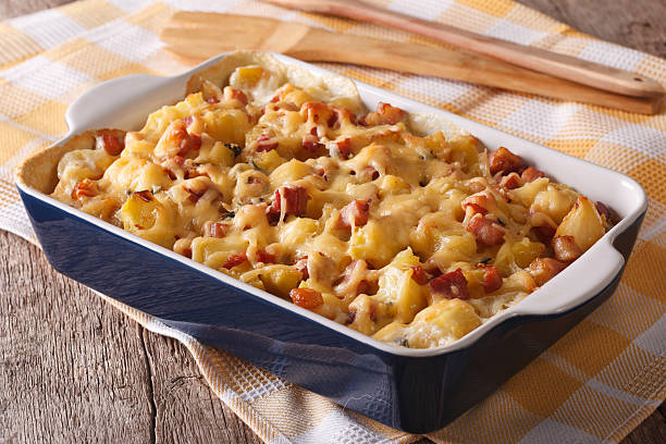 istock tartiflette: baked potatoes with bacon and cheese close up 615820108
