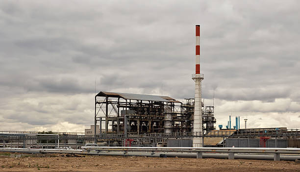 istock Old installation of a refinery smokestack 615820262