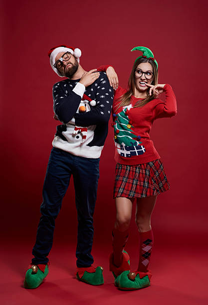 Funny couple in Christmas time Funny couple in Christmas time christmas nerd sweater cardigan stock pictures, royalty-free photos & images