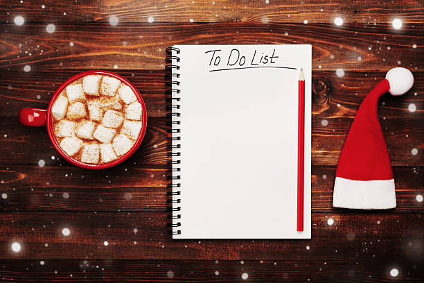 istock Cocoa or chocolate, santa hat and notebook. Christmas planning concept. 615821778