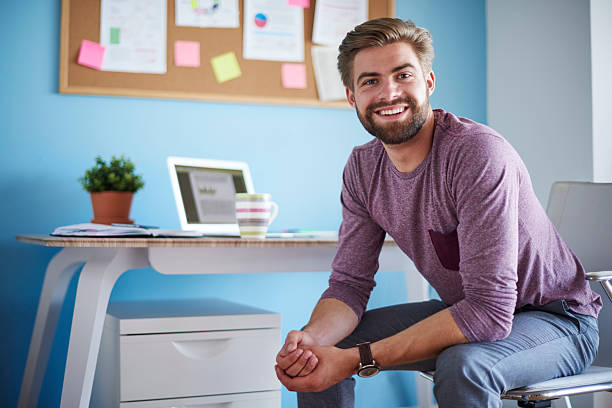 istock Man sitting in his home office 615823682