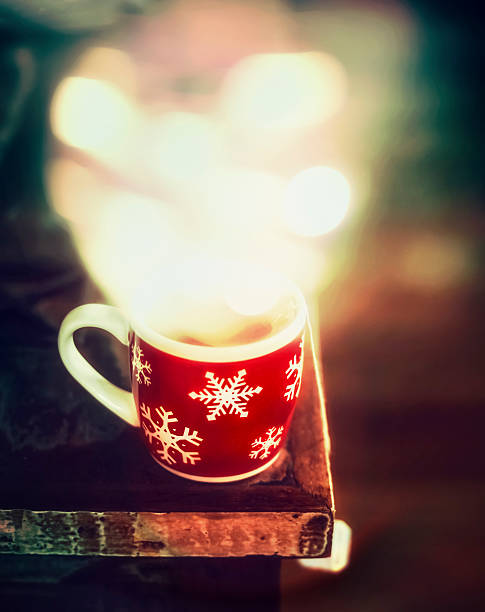 istock Winter snowflakes Cup with hot tea and bokeh 615824306