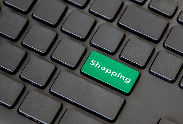 istock green shopping button on black keypad 615825758