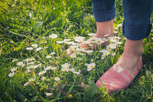 istock Girl standing in the meadow. 615826166