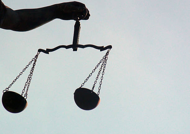 istock Lady Justice Holding Weight Scale,Summer Season Sky 615826680