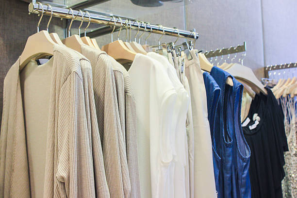 istock Formal clothes hang in the store 615828254