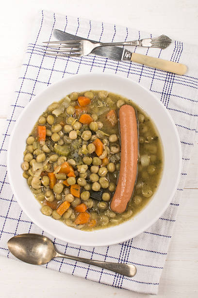istock peas soup with carrots and sausage in a deep plate 615830122