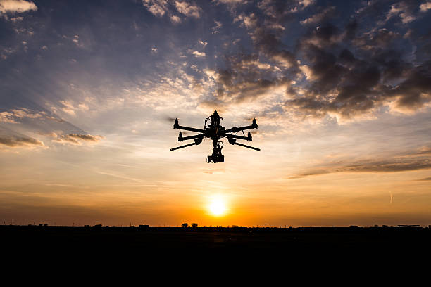 istock Professional drone flying in the sunset 615830128