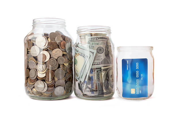 istock jar with coins and money, credit card 615830916